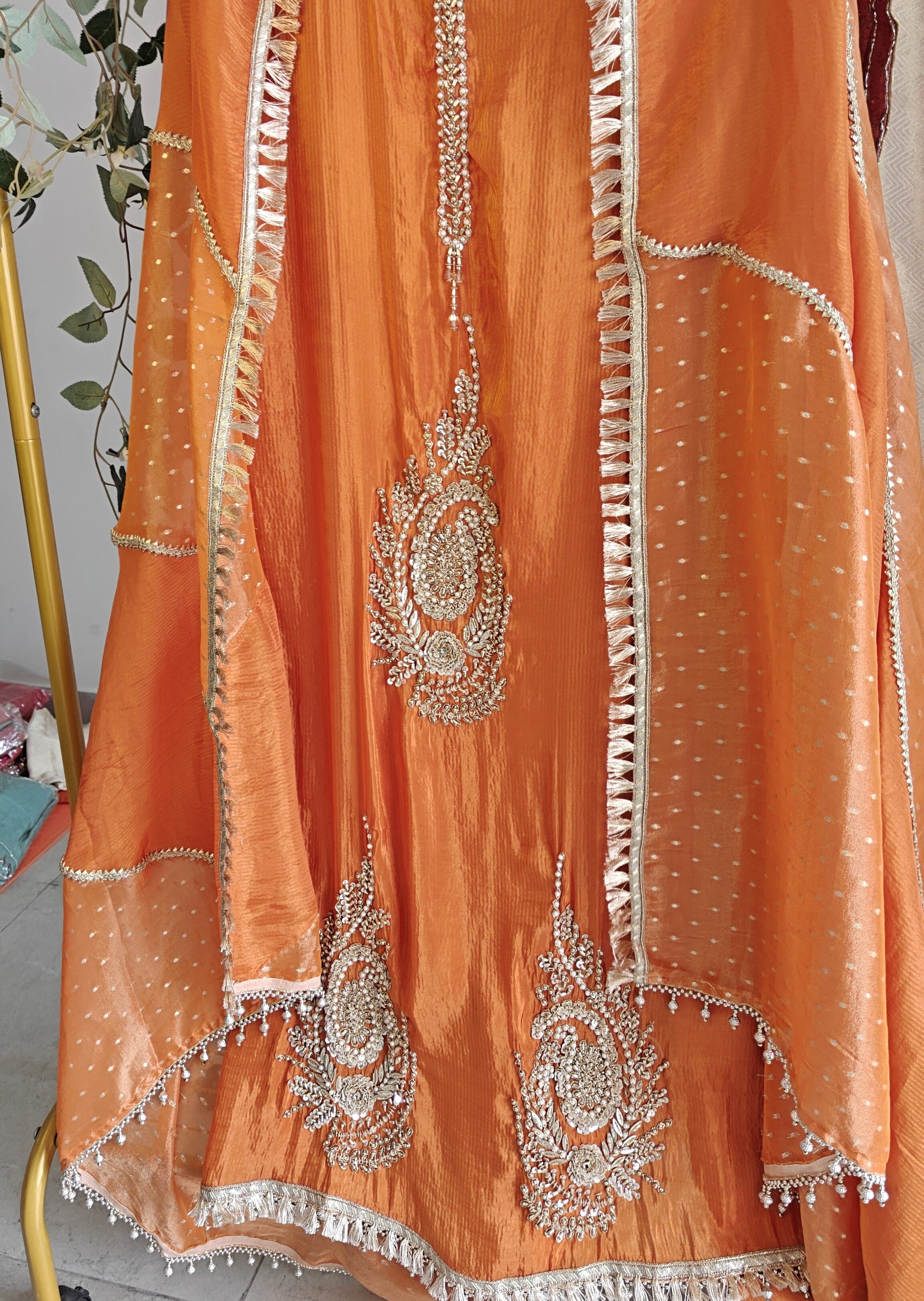 Orange Designer Partywear shimmer tissue unstitched suit.