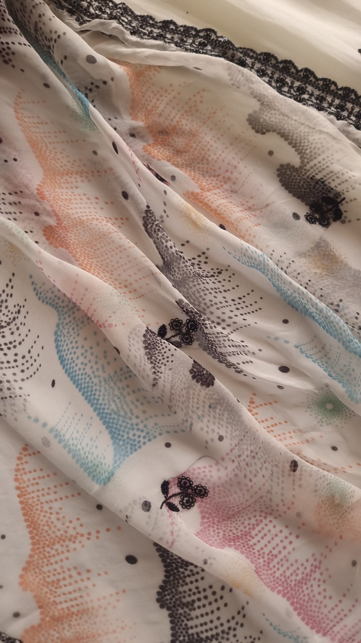 Opada Silk white with multi color thread work.