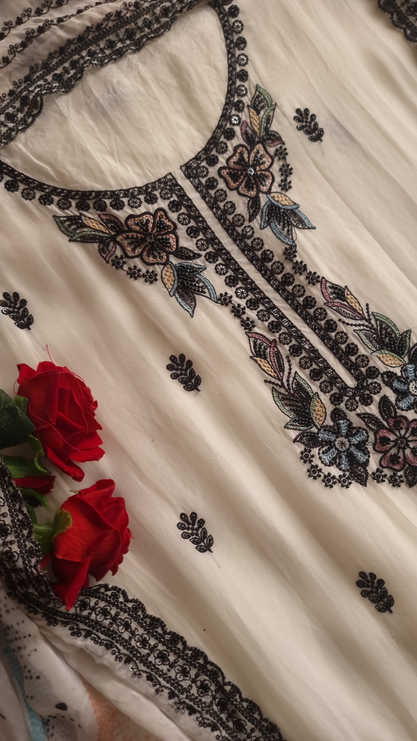 Opada Silk white with multi color thread work.