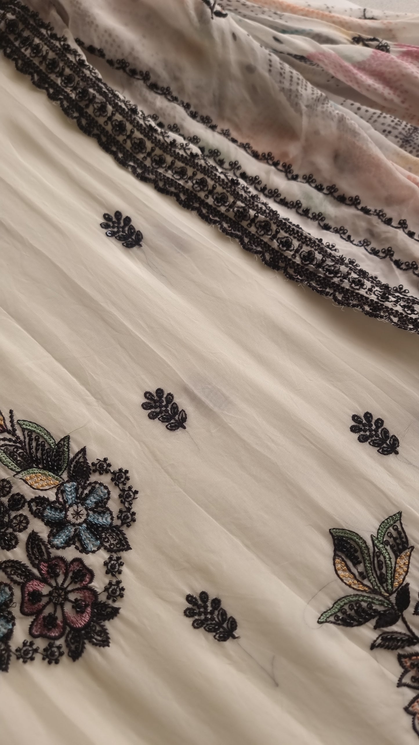 Opada Silk white with multi color thread work.