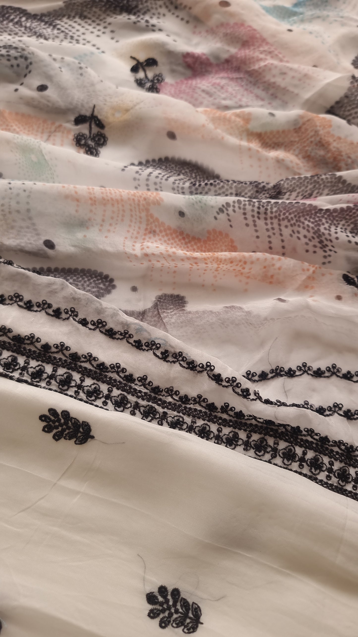 Opada Silk white with multi color thread work.