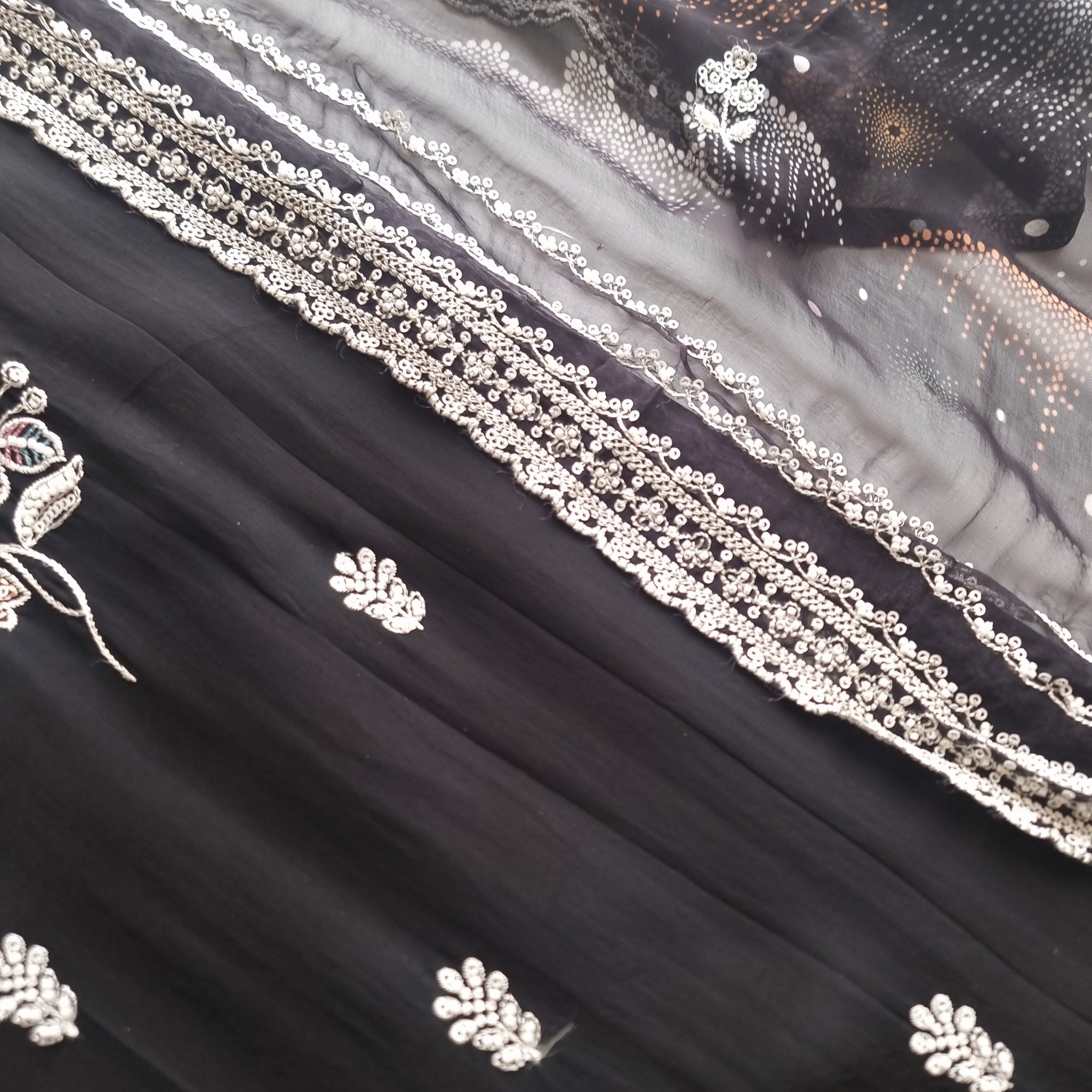 Black Opada Silk with multi color thread work.