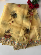 Floral Organza Saree with floral and beaded border.