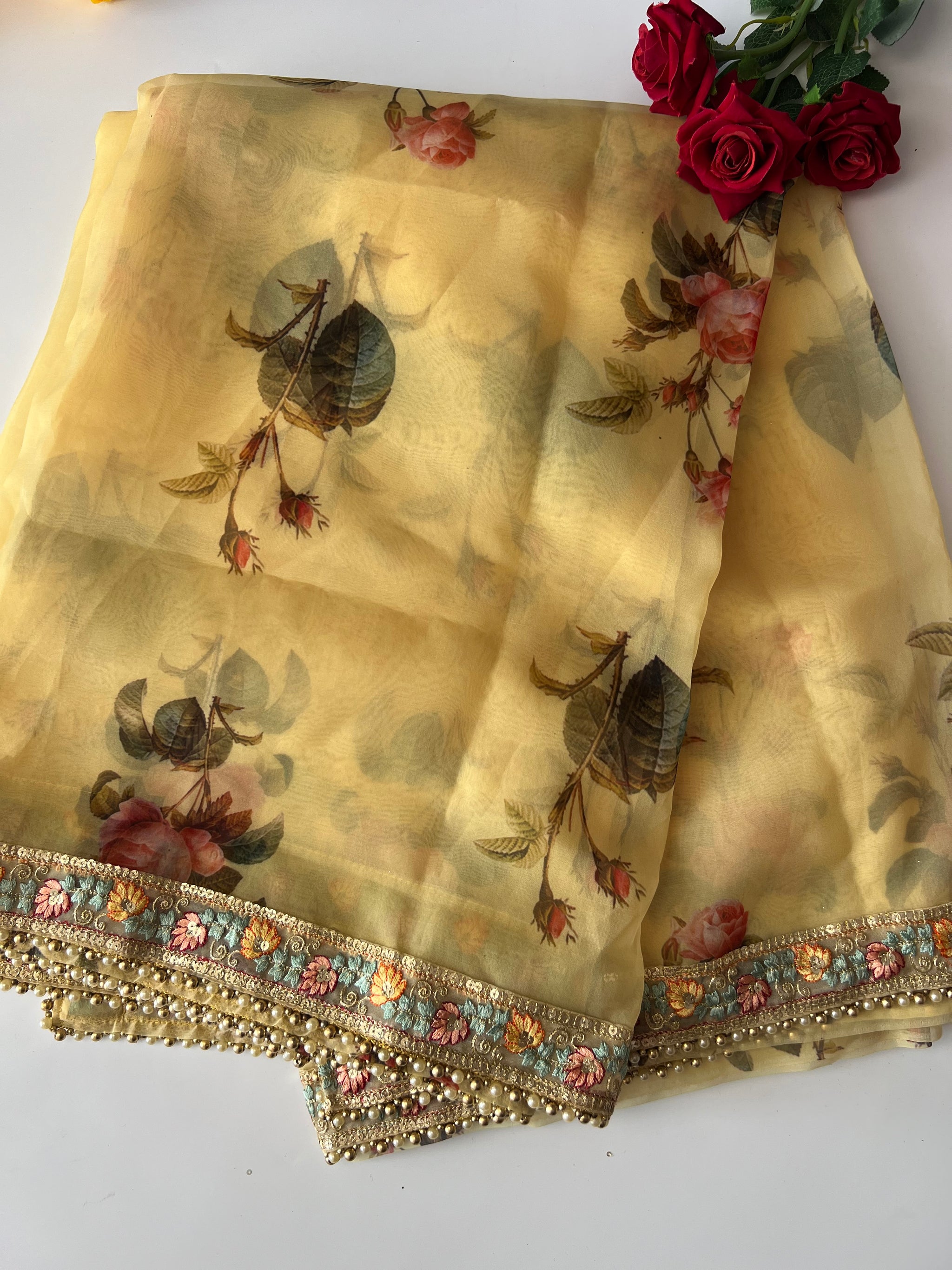 Floral Organza Saree with floral and beaded border.