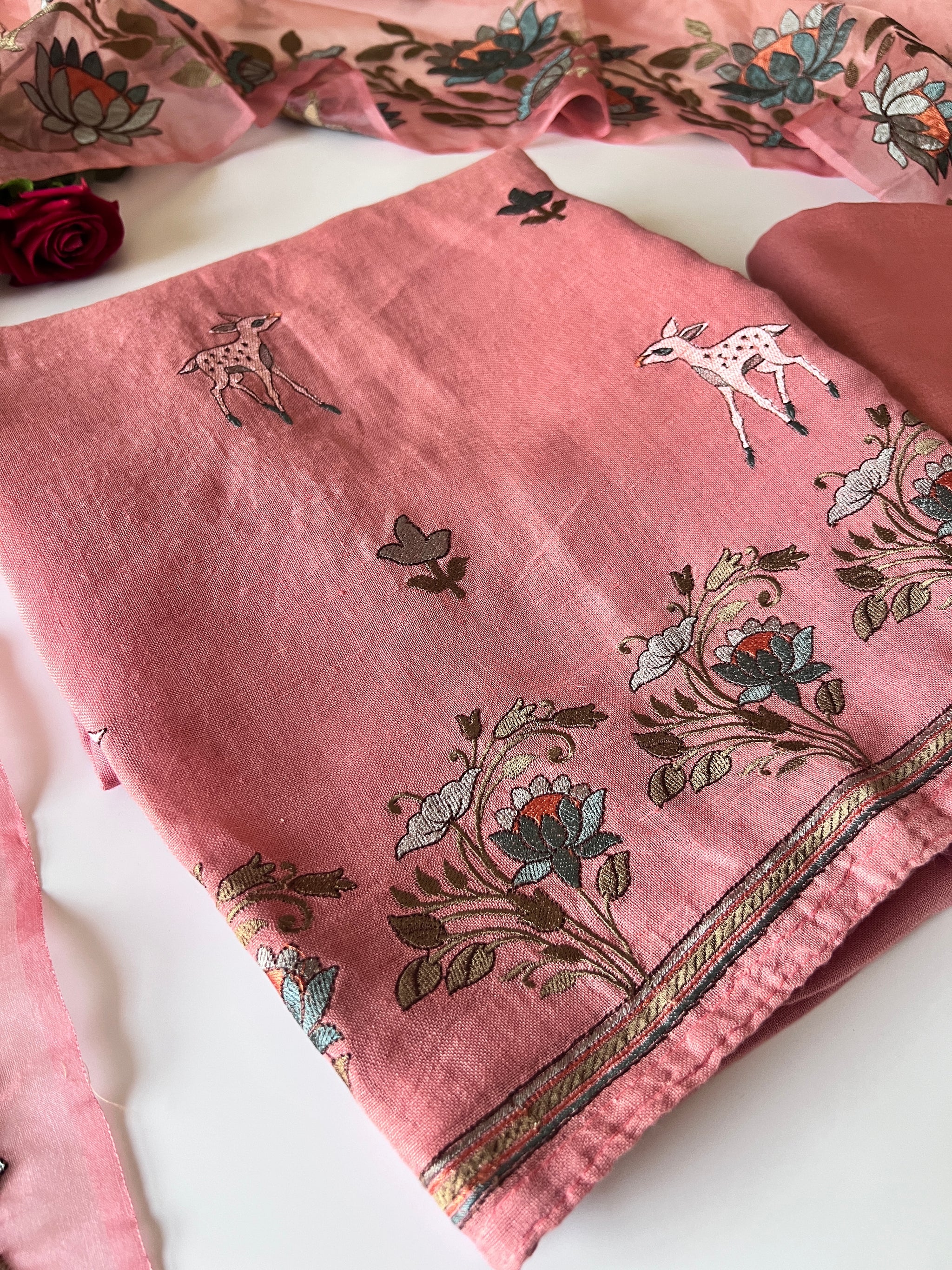 Pure linen Shikargah embroidered unstitched suit.