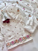 White linen unstitched suit with colorful floral embroidery for women