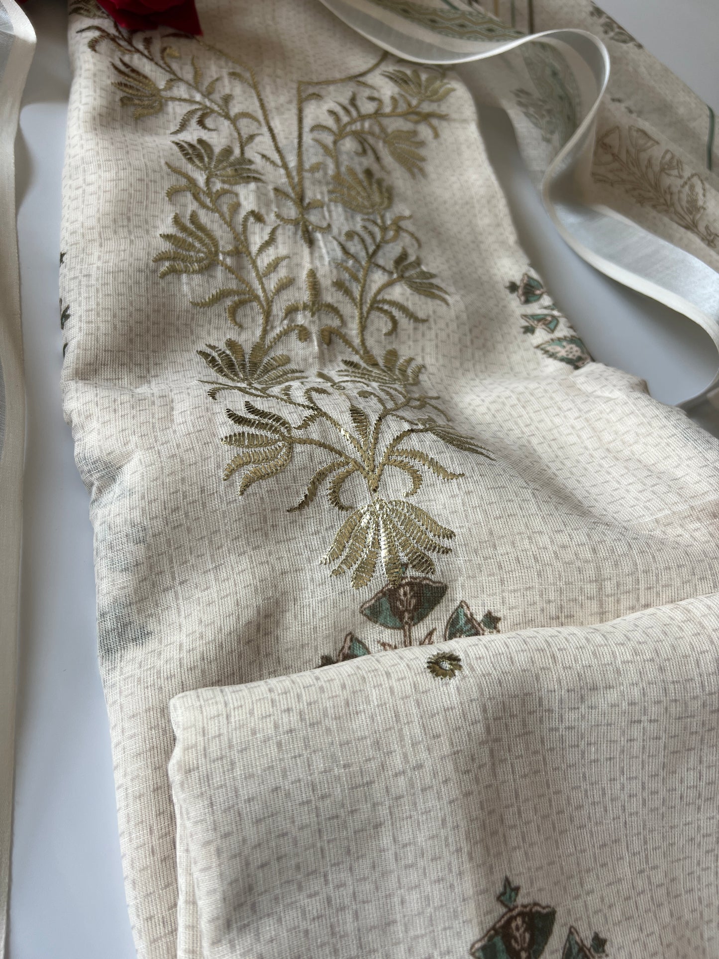 Designer mul linen suit material in light cream shade with sophisticated pitta embroidery work