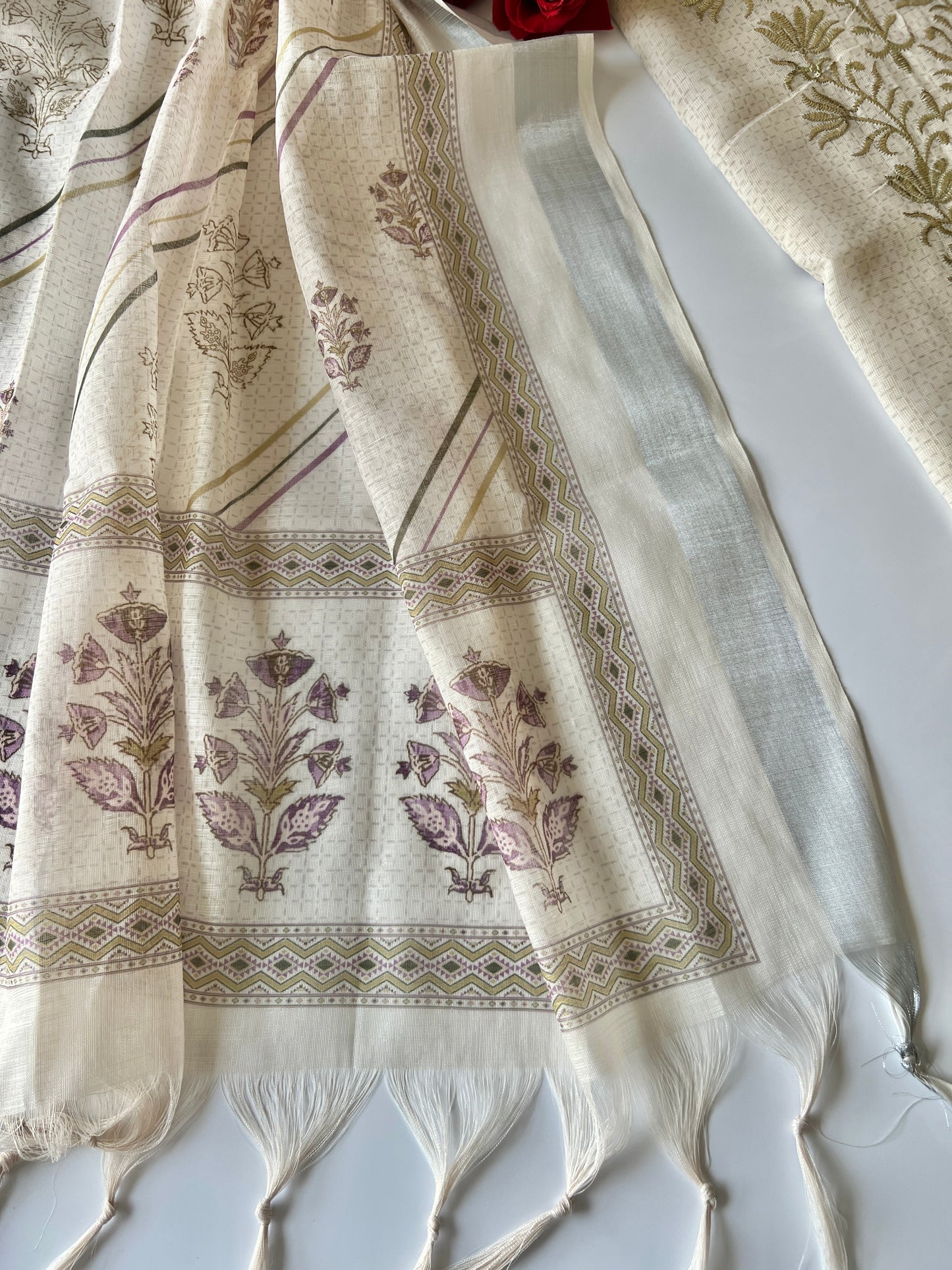 Women’s cream ethnic dress material with graceful all over prints and refined mul linen texture