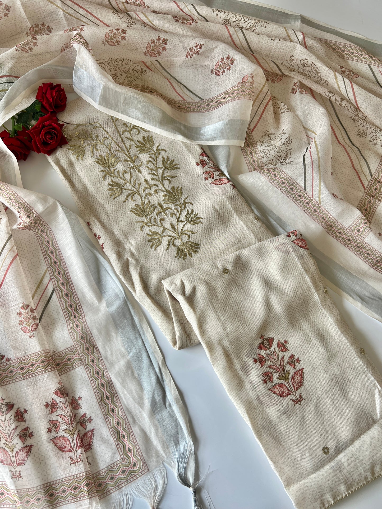 Premium cream ethnic dress material with stylish all over print and refined traditional detailing