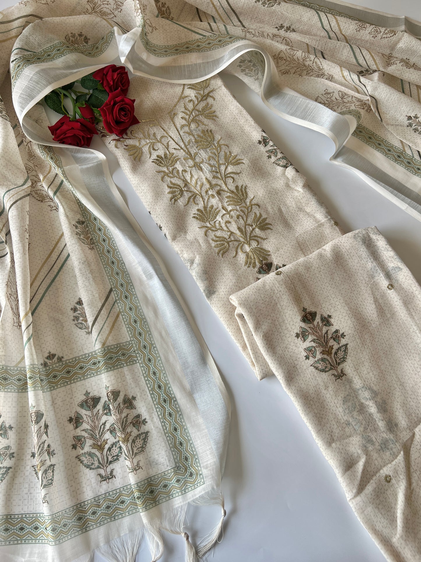 Cream mul linen salwar suit material with stylish all over print and handcrafted ethnic detailing