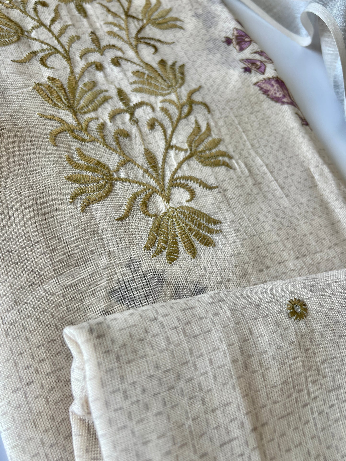 Cream mul linen salwar suit material with stylish all over print and handcrafted ethnic detailing