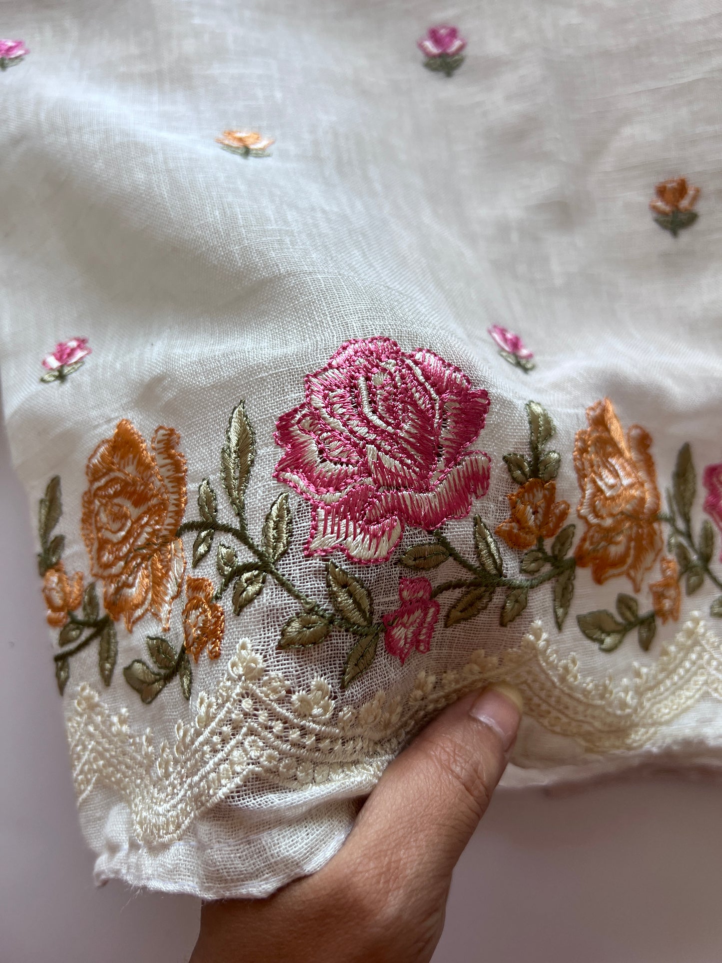 Elegant white linen dress material with multicolor flower embroidery