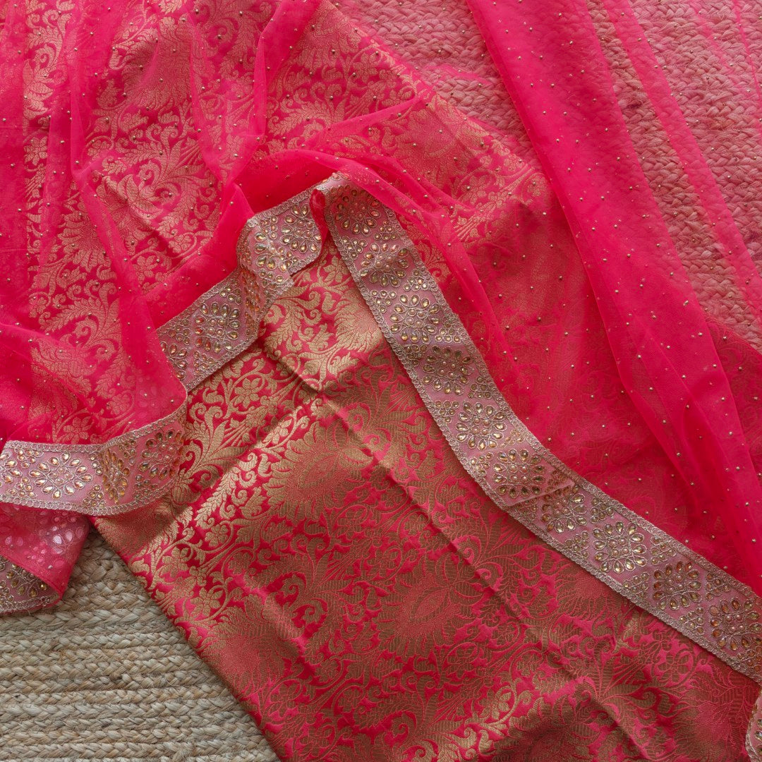 Festive wedding wear suit material with brocade kurta piece and kundan embellished net dupatta