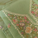 Pastel green unstitched salwar suit material with floral thread embroidery on neckline
