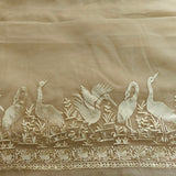 Decorative fabric with embroidered birds and plants on a beige background