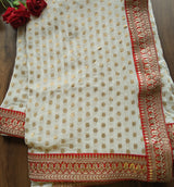 Off white Saree with Red border. Traditional sari