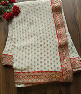 Off white Saree with Red border. Traditional sari