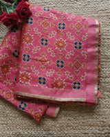Pink tussar silk patola print saree.