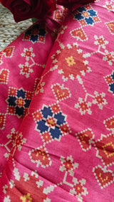 Pink tussar silk patola print saree.