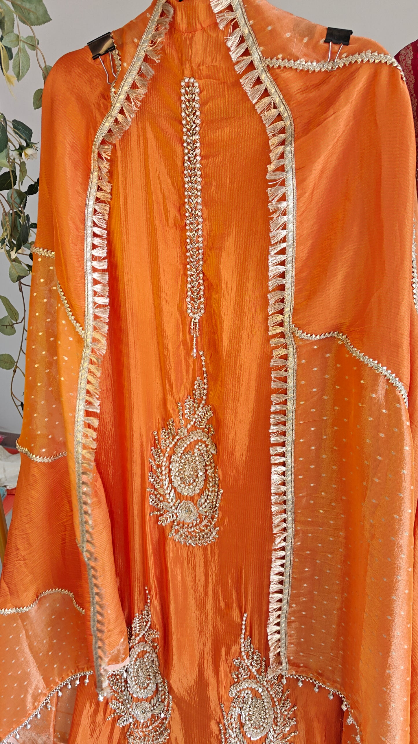 Orange Designer Partywear shimmer tissue unstitched suit.
