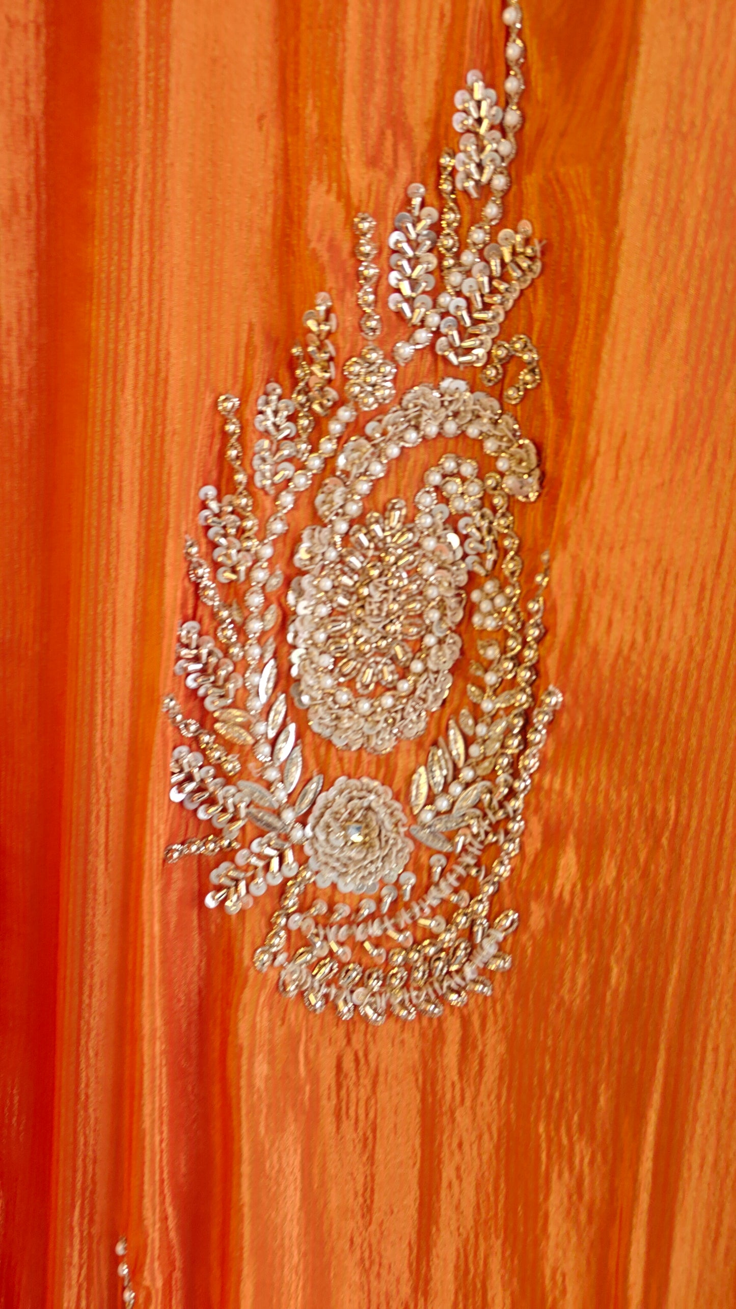 Orange Designer Partywear shimmer tissue unstitched suit.