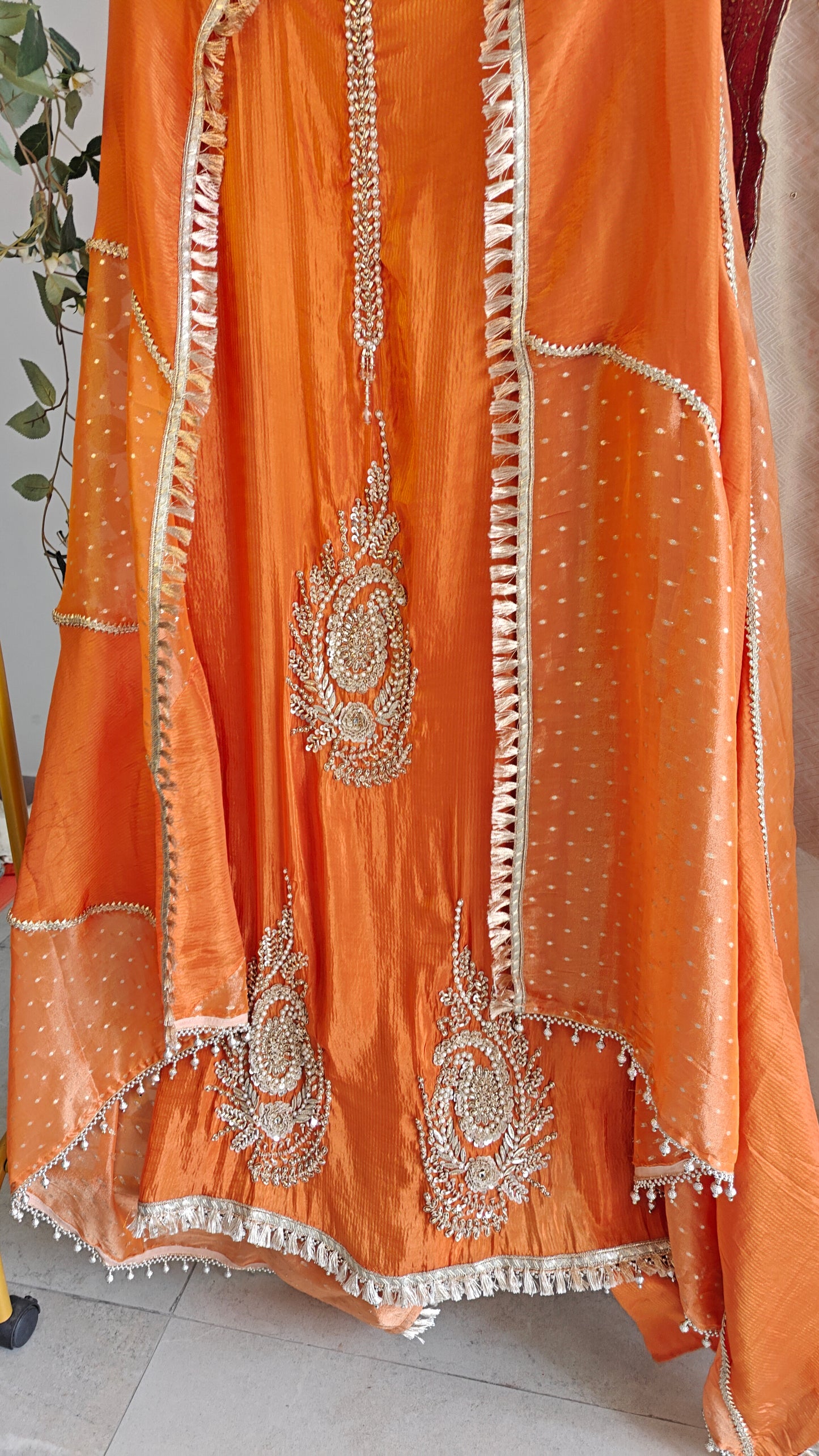 Orange Designer Partywear shimmer tissue unstitched suit.