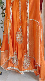Orange Designer Partywear shimmer tissue unstitched suit.