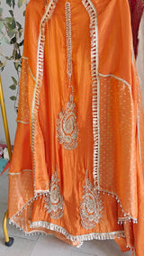 Orange Designer Partywear shimmer tissue unstitched suit.