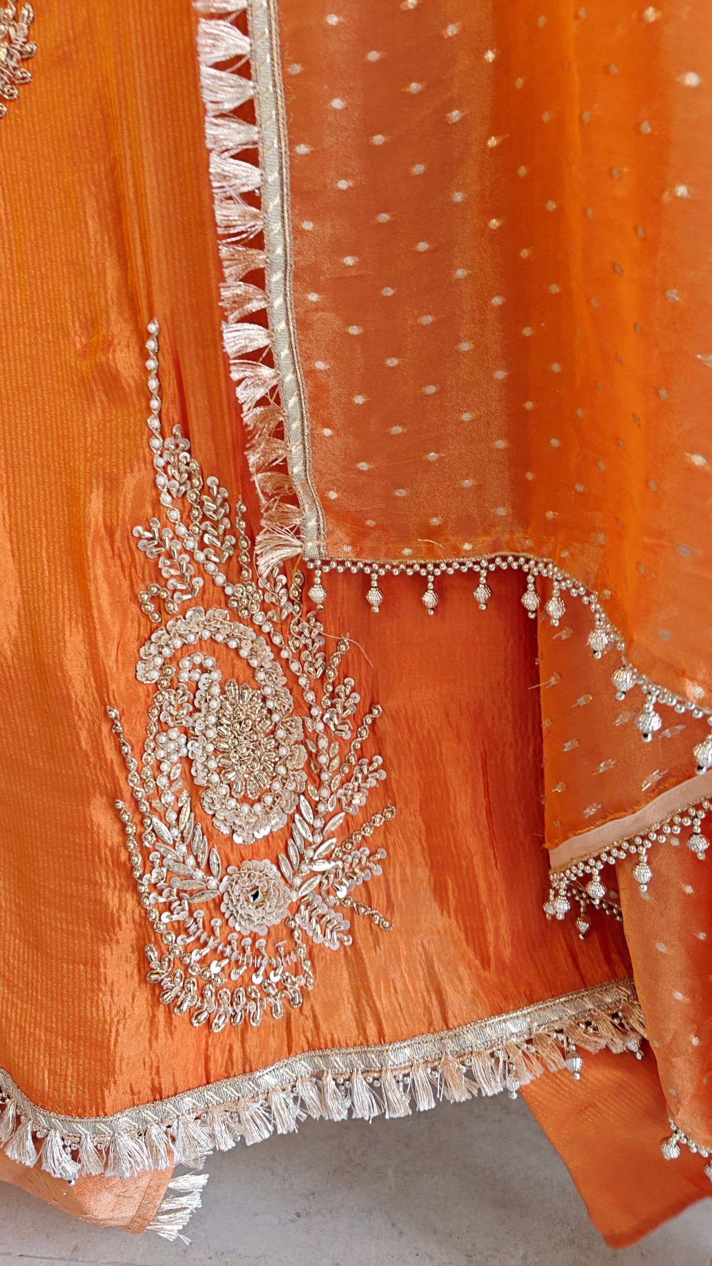 Orange Designer Partywear shimmer tissue unstitched suit.