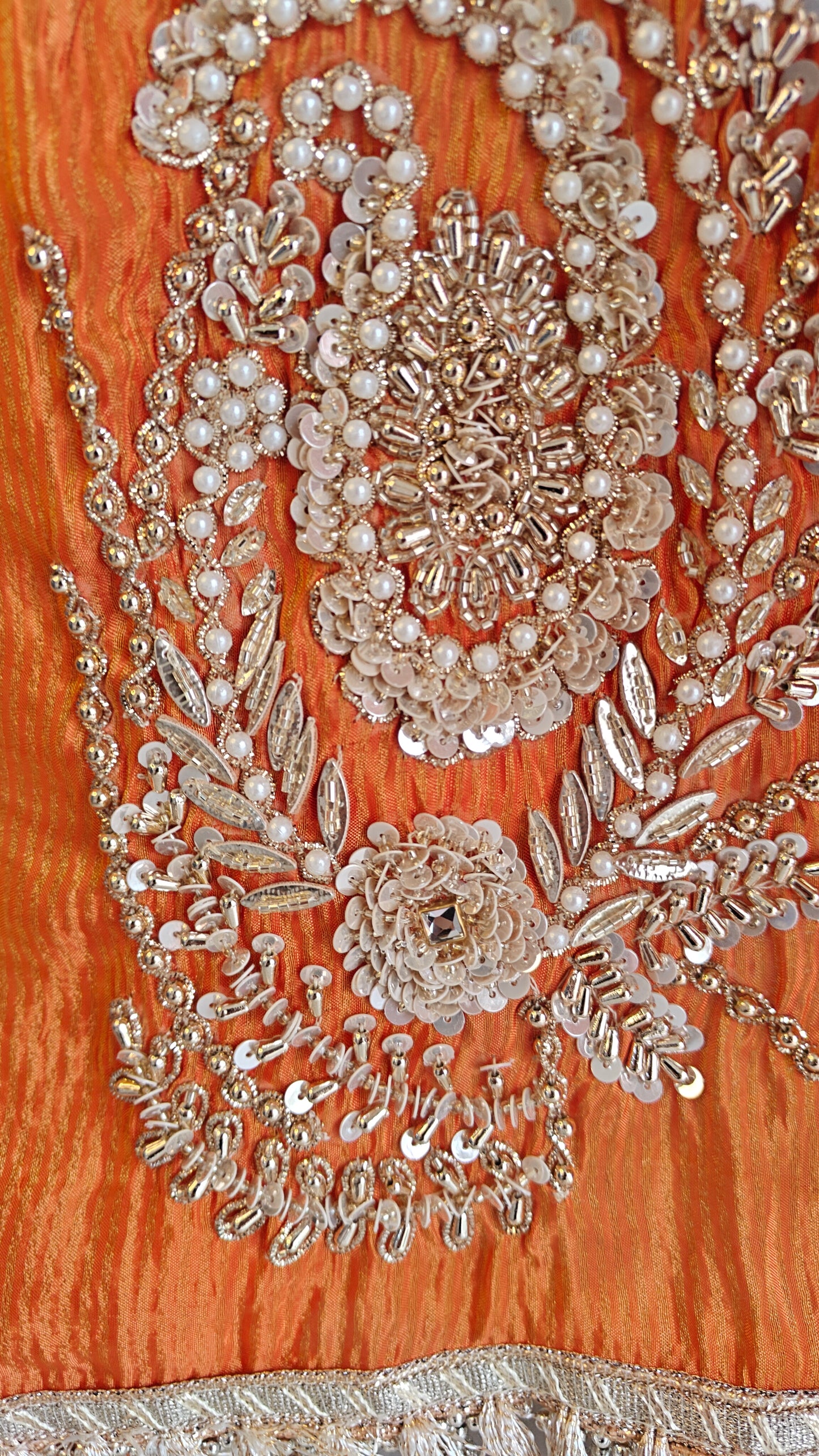 Orange Designer Partywear shimmer tissue unstitched suit.