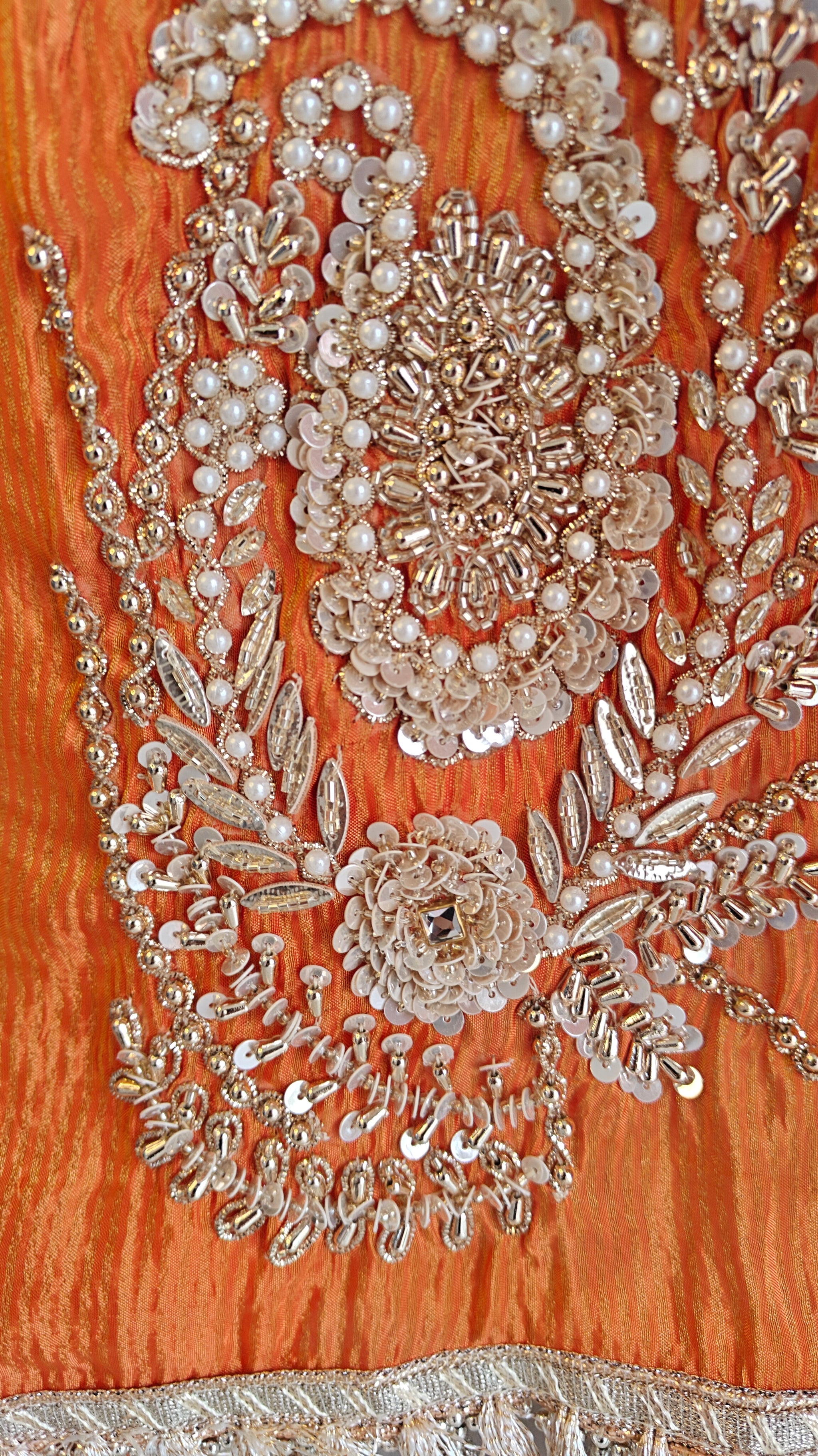 Orange Designer Partywear shimmer tissue unstitched suit.
