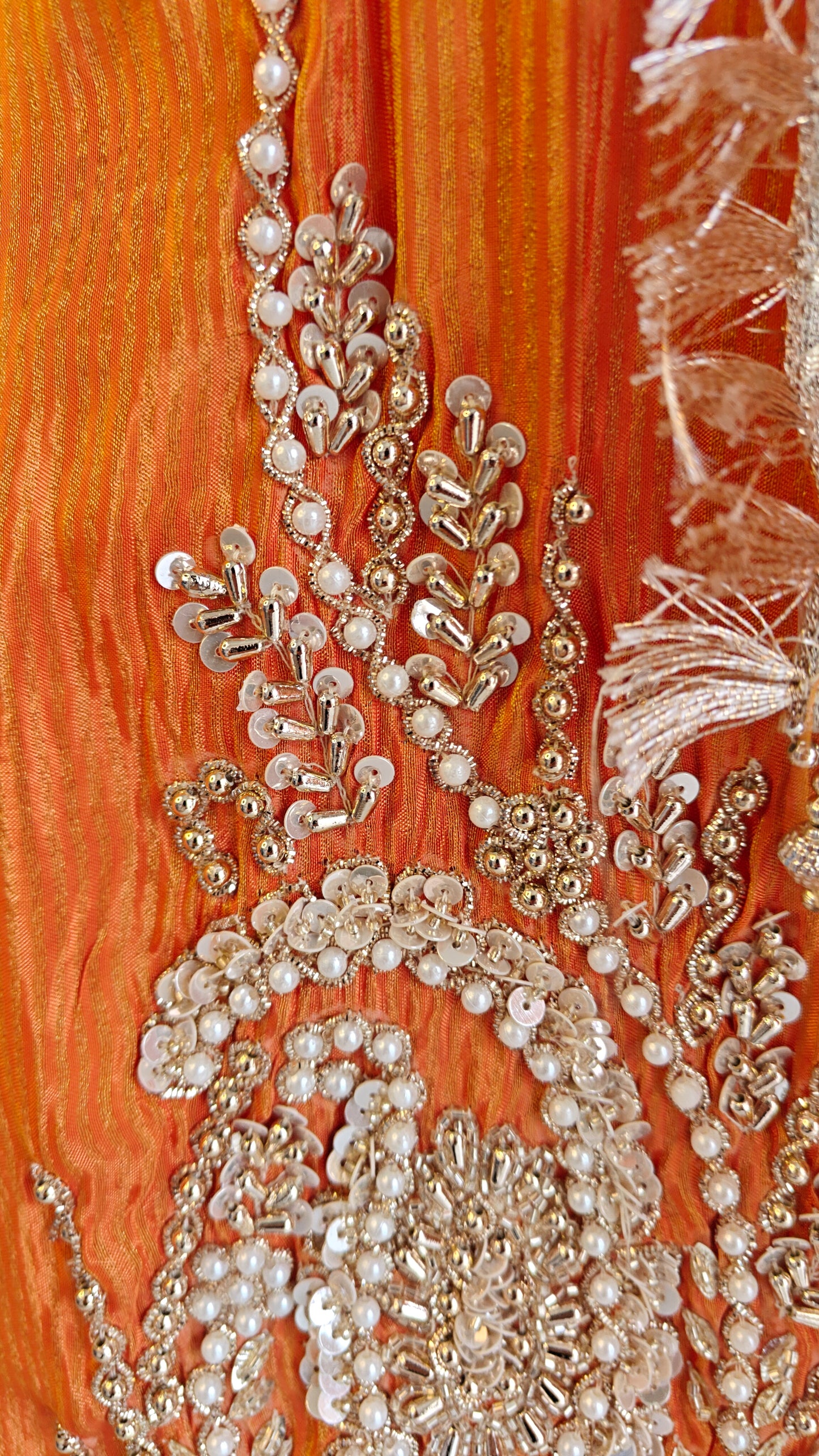 Orange Designer Partywear shimmer tissue unstitched suit.
