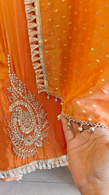 Orange Designer Partywear shimmer tissue unstitched suit.