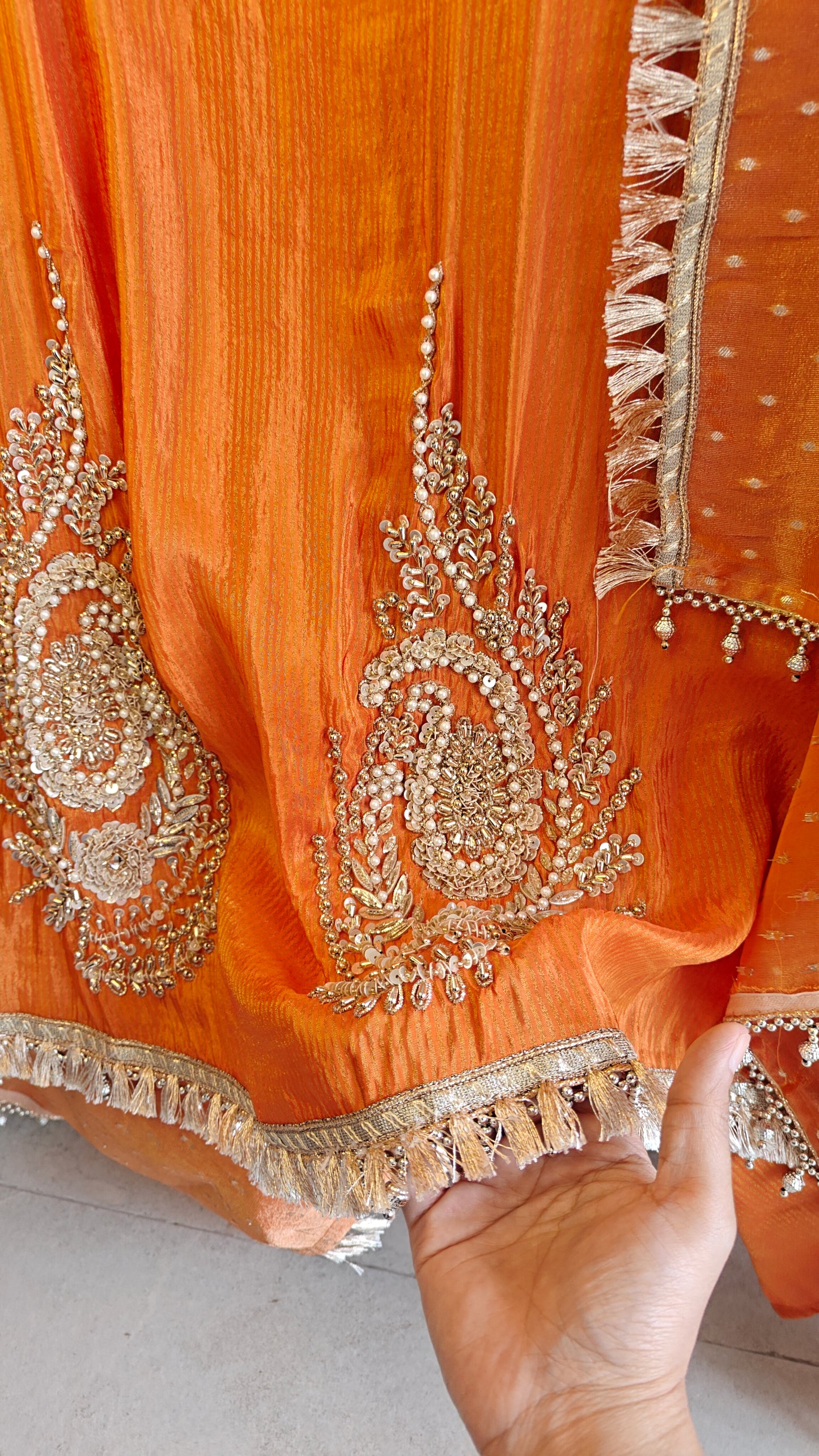 Orange Designer Partywear shimmer tissue unstitched suit.