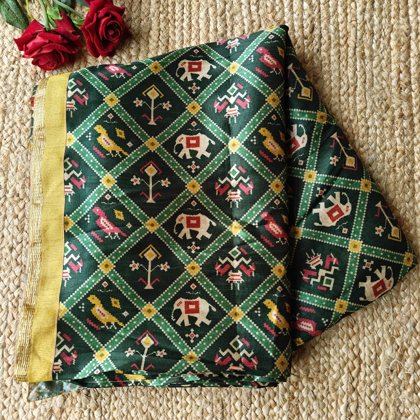 Green tussar silk patola print saree.