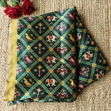 Green tussar silk patola print saree.