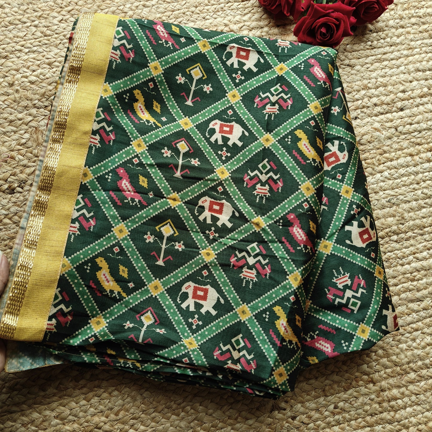 Green tussar silk patola print saree.