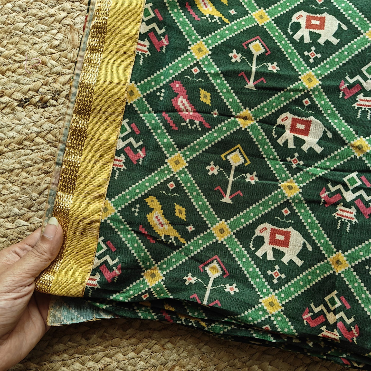 Green tussar silk patola print saree.