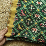 Green tussar silk patola print saree.