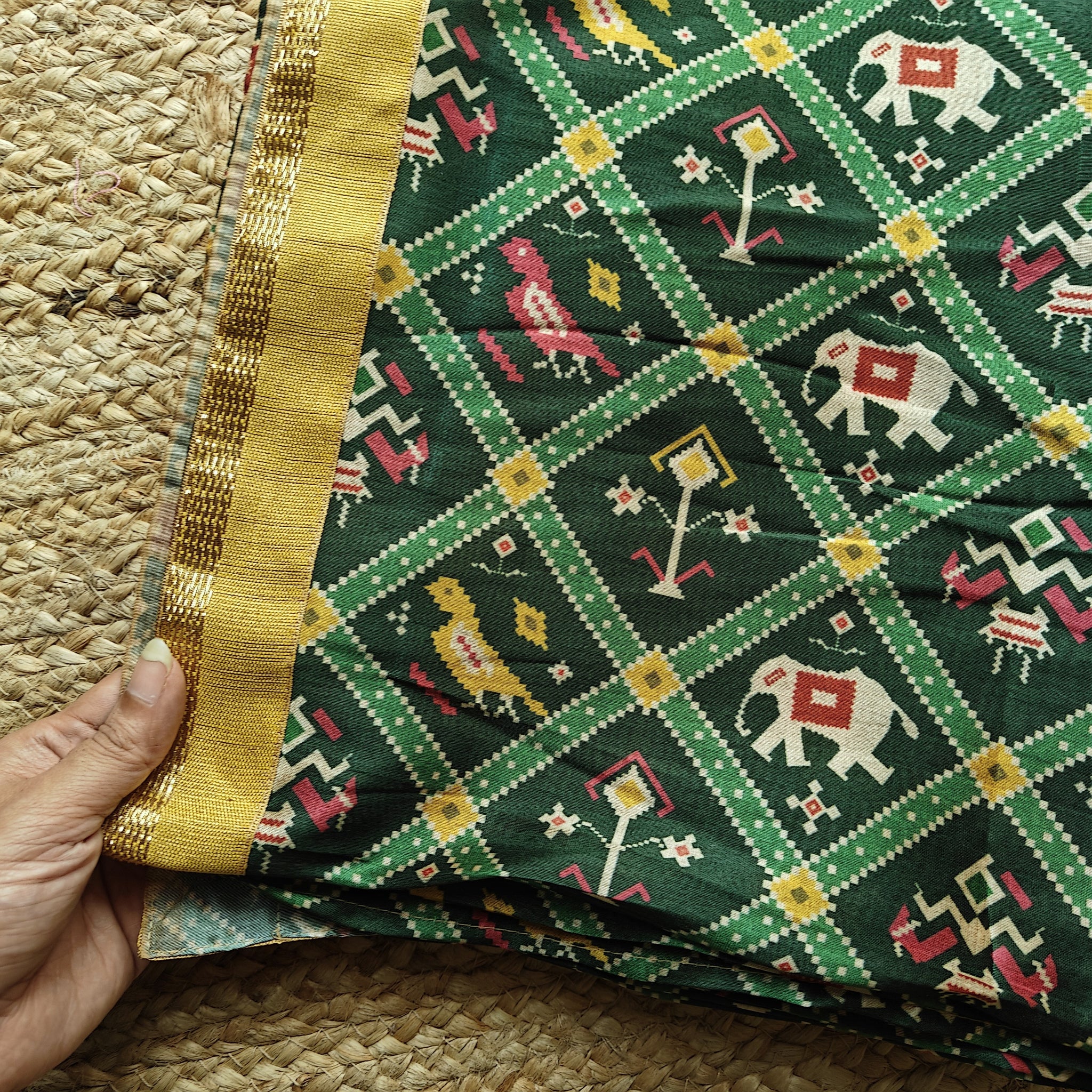 Green tussar silk patola print saree.