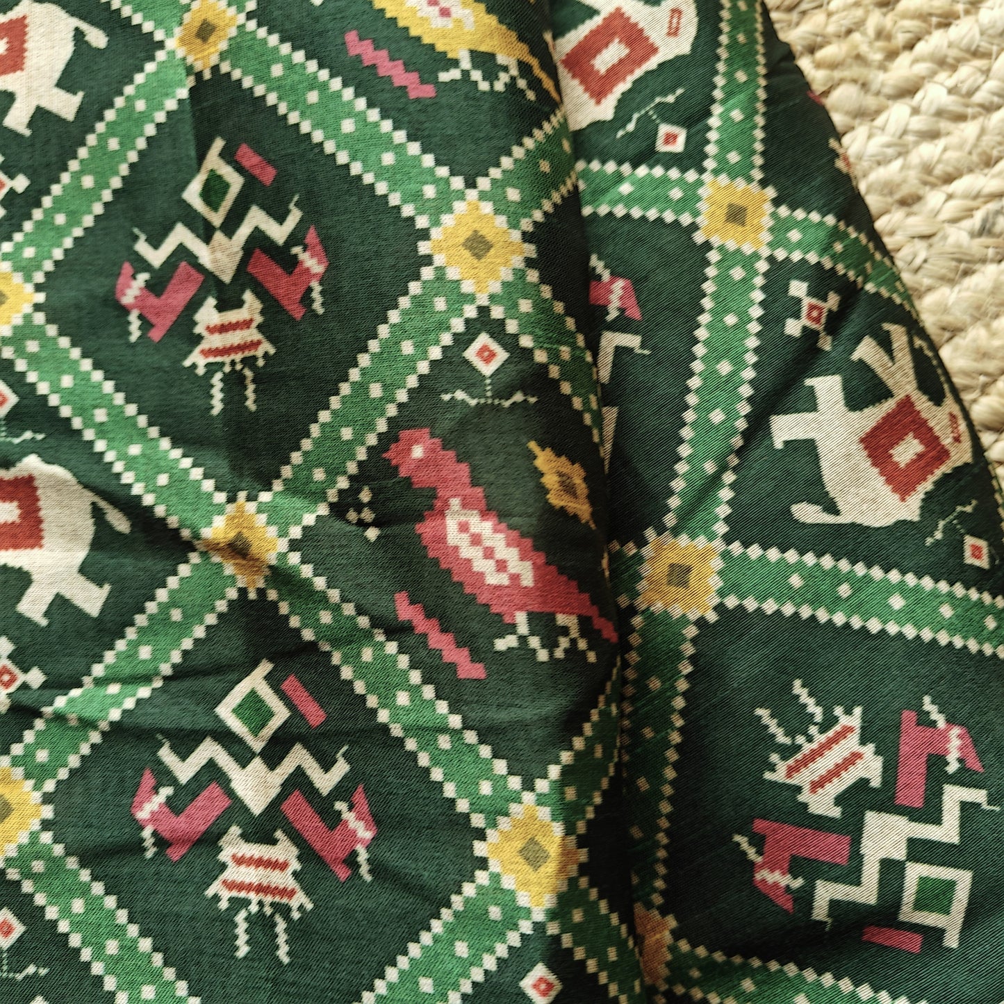 Green tussar silk patola print saree.