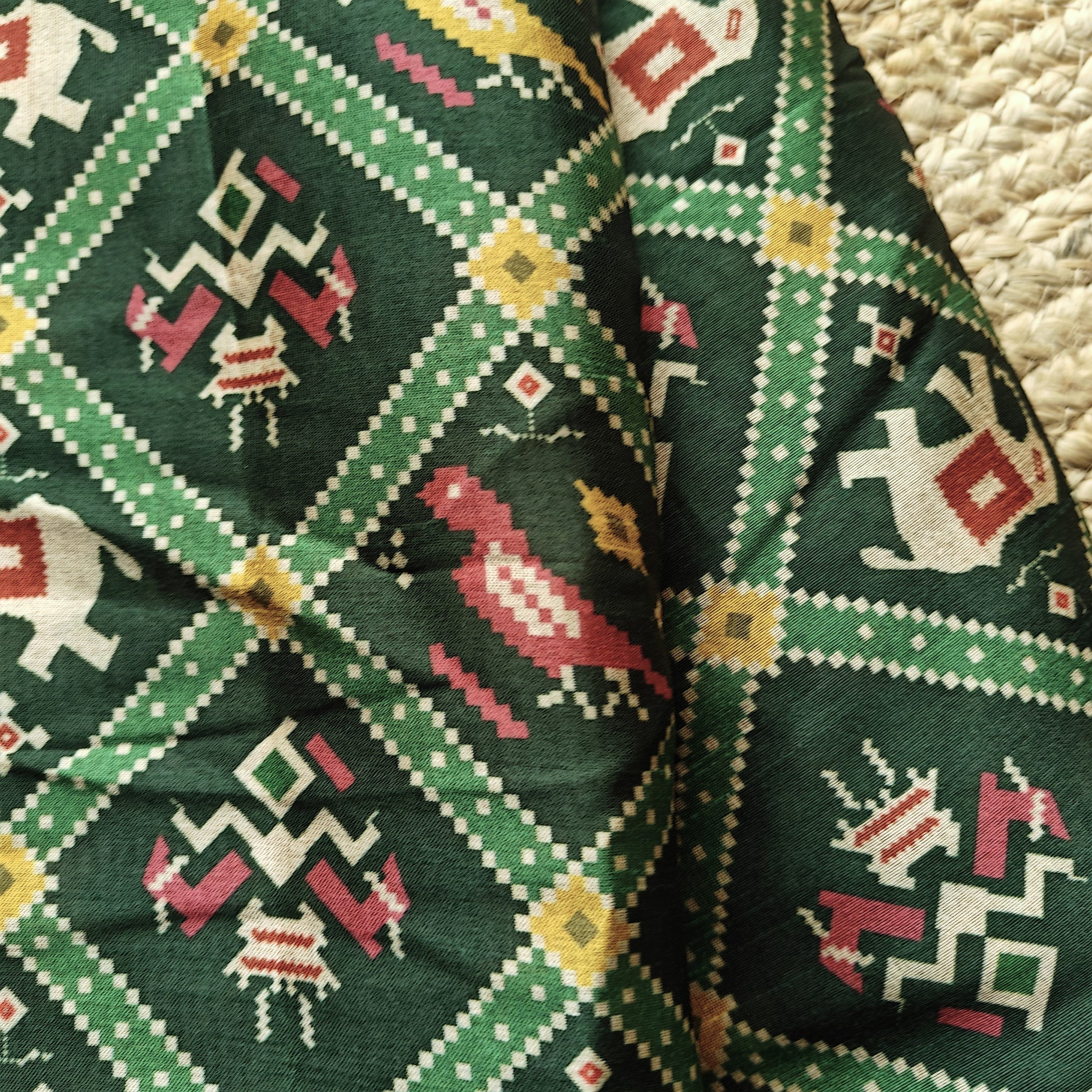 Green tussar silk patola print saree.