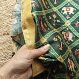 Green tussar silk patola print saree.
