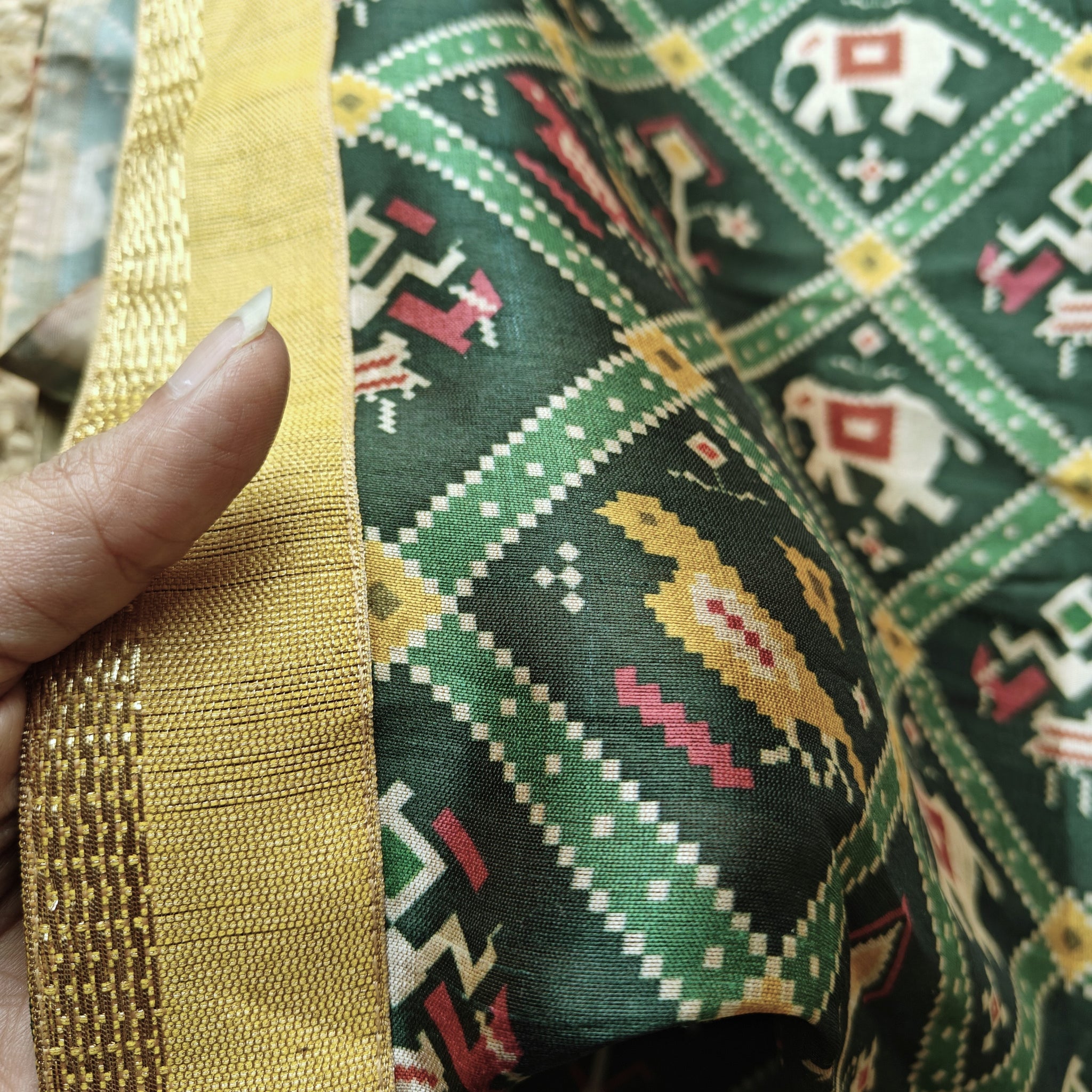 Green tussar silk patola print saree.