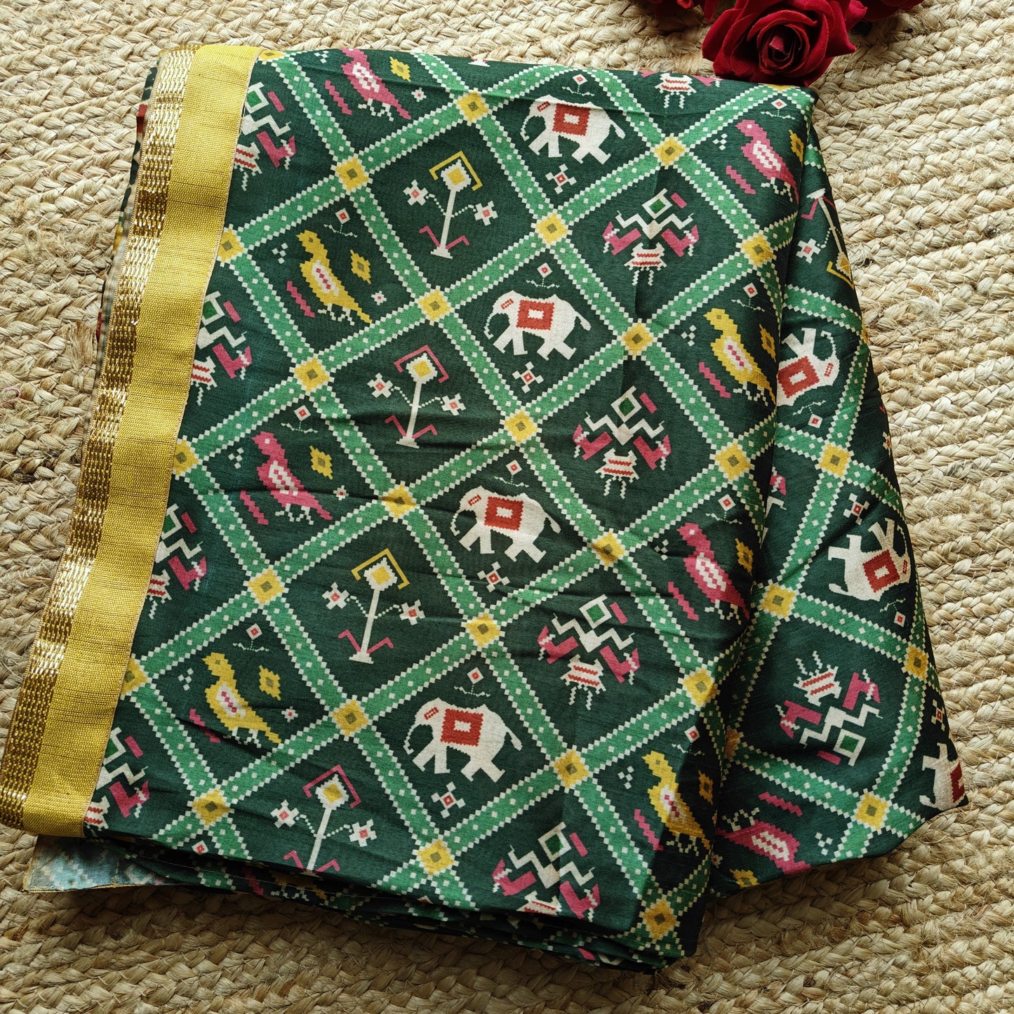 Green tussar silk patola print saree.