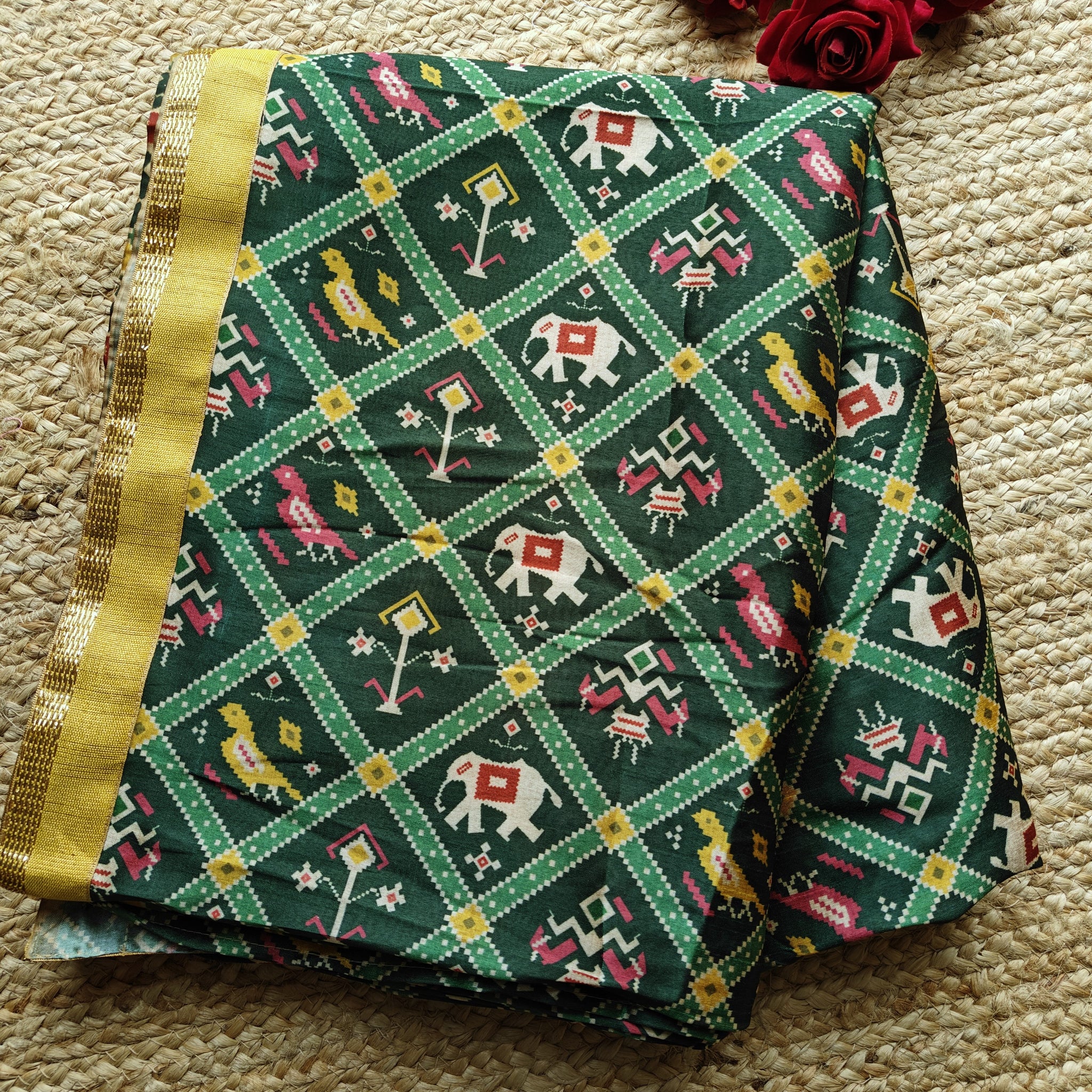 Green tussar silk patola print saree.