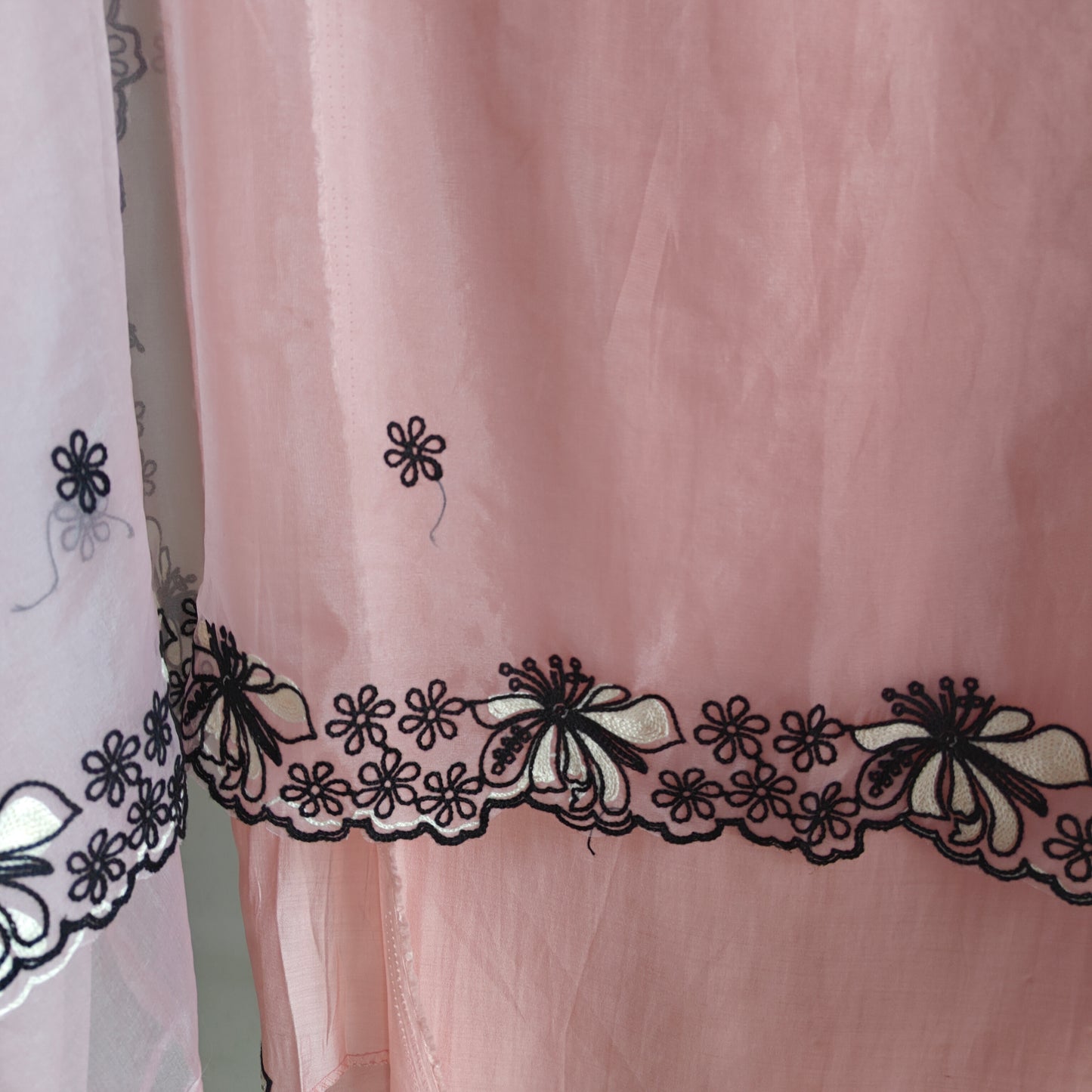 Peach pink tissue dress material with black embroidery