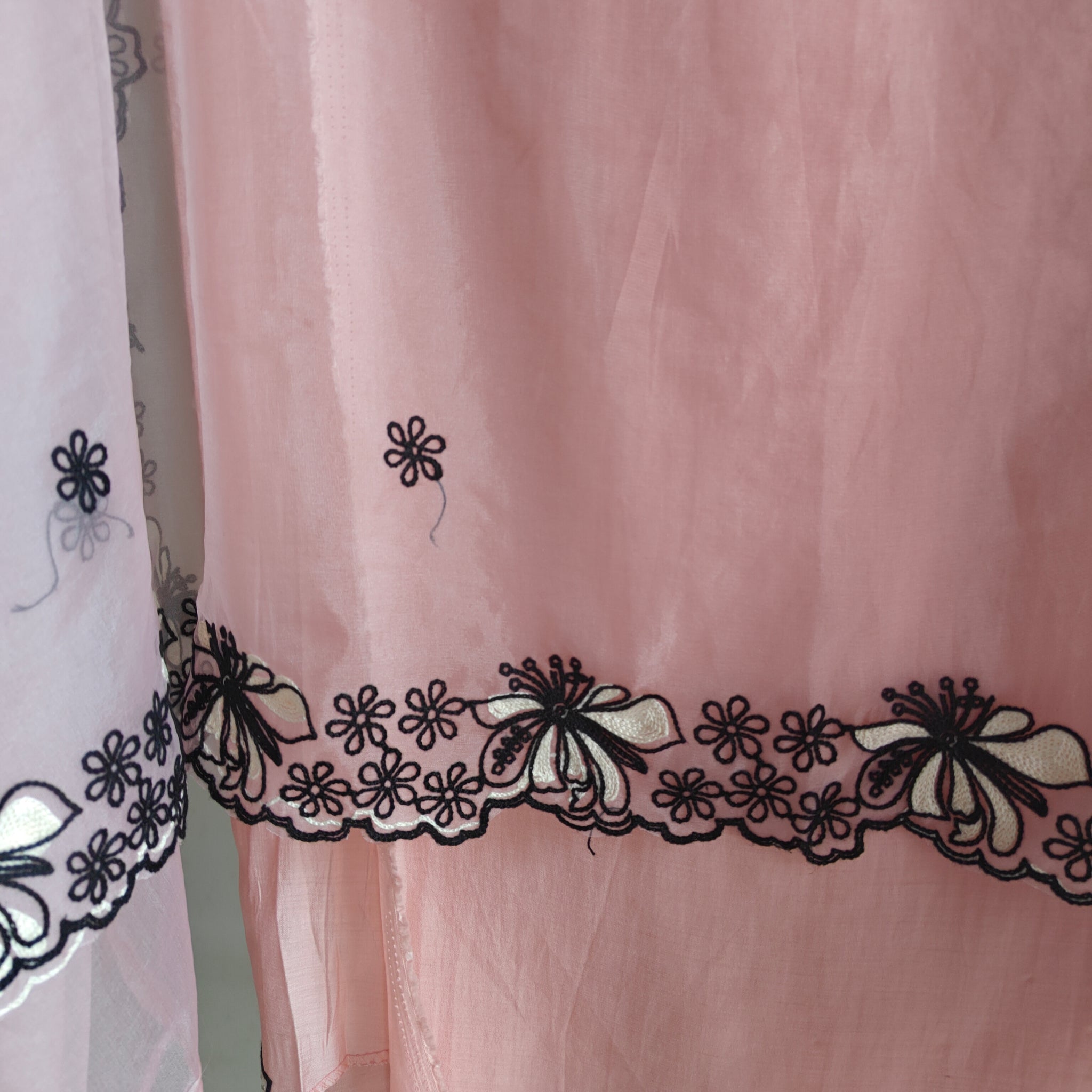 Peach pink tissue dress material with black embroidery
