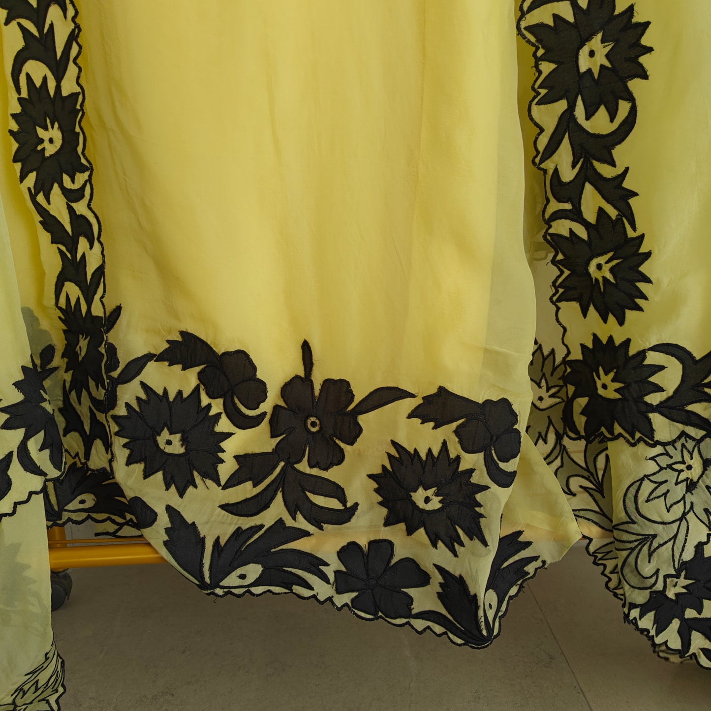 Yellow Georgette dress material with Black patchwork