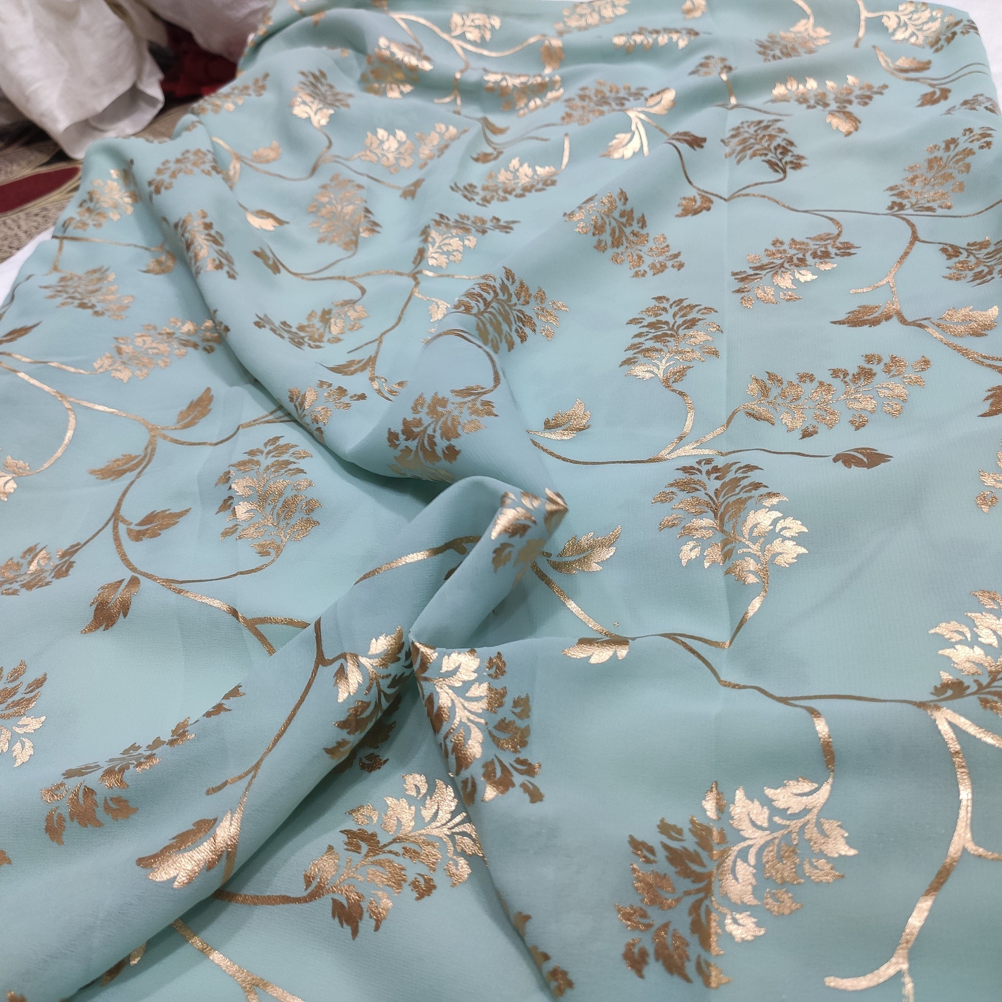 Sage green georgette with golden foil work fabric